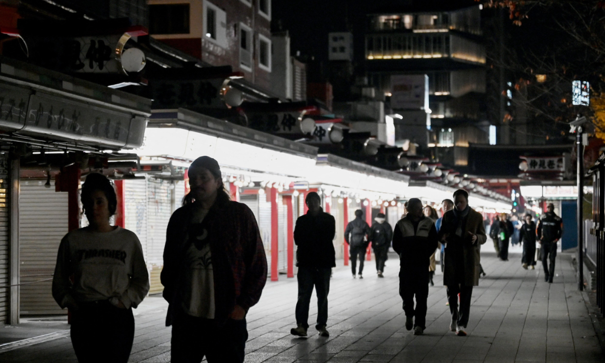 People walk at the Sensoji temple in the Asakusa district in Tokyo on December 1, 2025. Photo: VCG