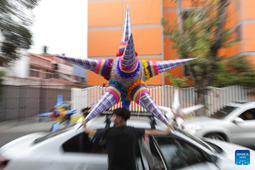 A pinata is pictured outside a family workshop in Mexico City, Mexico, on Dec. 16, 2025. Pinata, traditionally crafted in the shape of a seven-pointed star, is filled with candies and small gifts, bringing joy and festive spirit to celebrations. (Xinhua/Francisco Canedo)