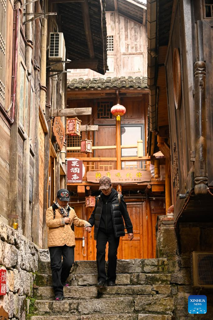 Tourists visit the Gongtan Ancient Town in Youyang Tujia and Miao Autonomous County, southwest China's Chongqing Municipality, on Dec. 11, 2025. (Photo by Qiu Hongbin/Xinhua)