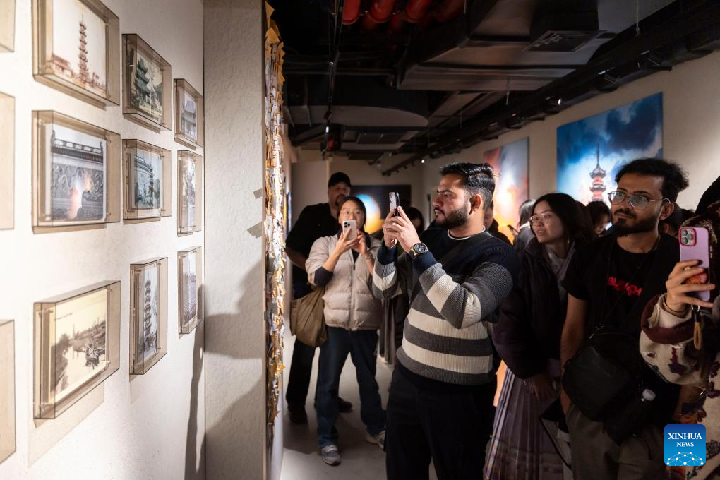 Guests attending the 4th Shanghai International Literature Week visit Tower Shadow, a cultural space in east China's Shanghai, Dec. 17, 2025. (Xinhua/Wang Xiang)