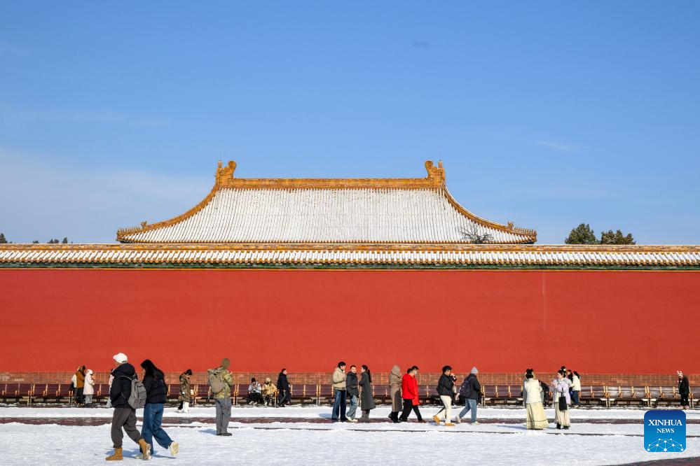 Tourists visit the Palace Museum after snowfall in Beijing, capital of China, Dec. 13, 2025. (Xinhua/Ma Xiaodong)