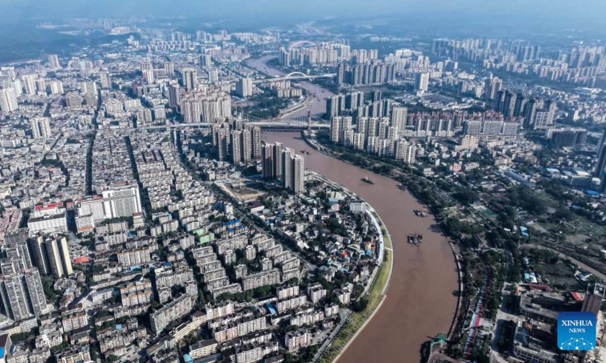 An aerial drone photo taken on Dec. 17, 2025 shows a reconstructed bridge over the Pinglu Canal in Qinzhou, south China's Guangxi Zhuang Autonomous Region. Three years on, the construction of the Pinglu Canal as a core component of the New International Land-Sea Trade Corridor has shown remarkable progress. Upon completion, the 134.2-km canal would wind its way across Nanning and Qinzhou of Guangxi until it reaches the Beibu Gulf. It is expected to serve as an artery for river-sea inter-modal transportation in the southwestern part of the country. (Xinhua/Zhang Ailin)