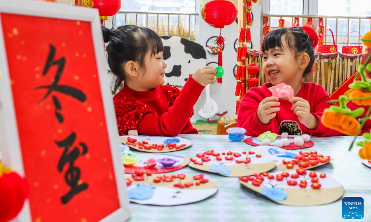 Children of a kindergarten make dumpling-shaped crafts in Tangshan City, north China's Hebei Province, Dec. 18, 2025. People all over the country held diverse events on Thursday to mark the Winter Solstice, which will fall on Dec. 21 this year. Winter Solstice, the shortest day of the year, denotes the beginning of deep winter and a break from farming in traditional agricultural society in Chinese culture. Northern China has maintained the tradition of eating dumplings on this day, while people in southern China eat tangyuan (glutinous rice balls). (Photo by Liu Mancang/Xinhua)