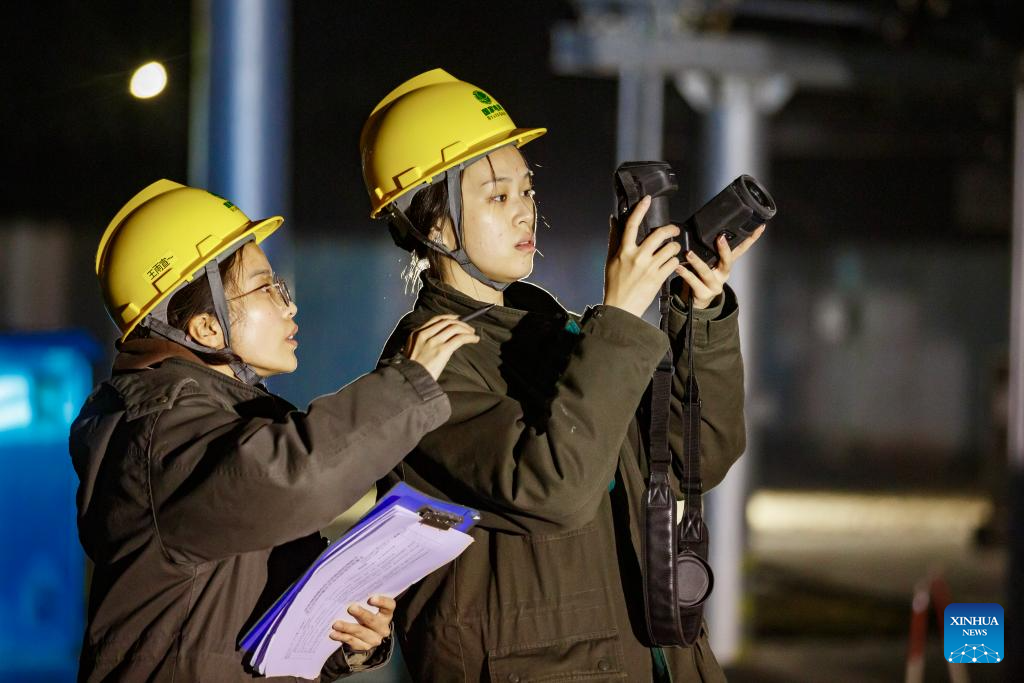 Staff members of a power supply company check the facilities at night at a transformer substation in Suixian County of Shangqiu City, central China's Henan Province, Dec. 10, 2025.

The National Meteorological Center on Wednesday issued a blue alert for a cold wave and a separate blue alert for strong winds, forecasting a widespread drop in temperatures and the first large-scale snowfall this winter across northern China over the next few days. (Photo by Xu Zeyuan/Xinhua)