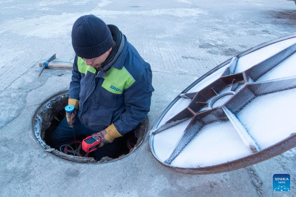A staff member of a heating company inspects the heating network in Fujin City, northeast China's Heilongjiang Province, Dec. 11, 2025.

The National Meteorological Center on Wednesday issued a blue alert for a cold wave and a separate blue alert for strong winds, forecasting a widespread drop in temperatures and the first large-scale snowfall this winter across northern China over the next few days. (Photo by Qu Yubao/Xinhua)