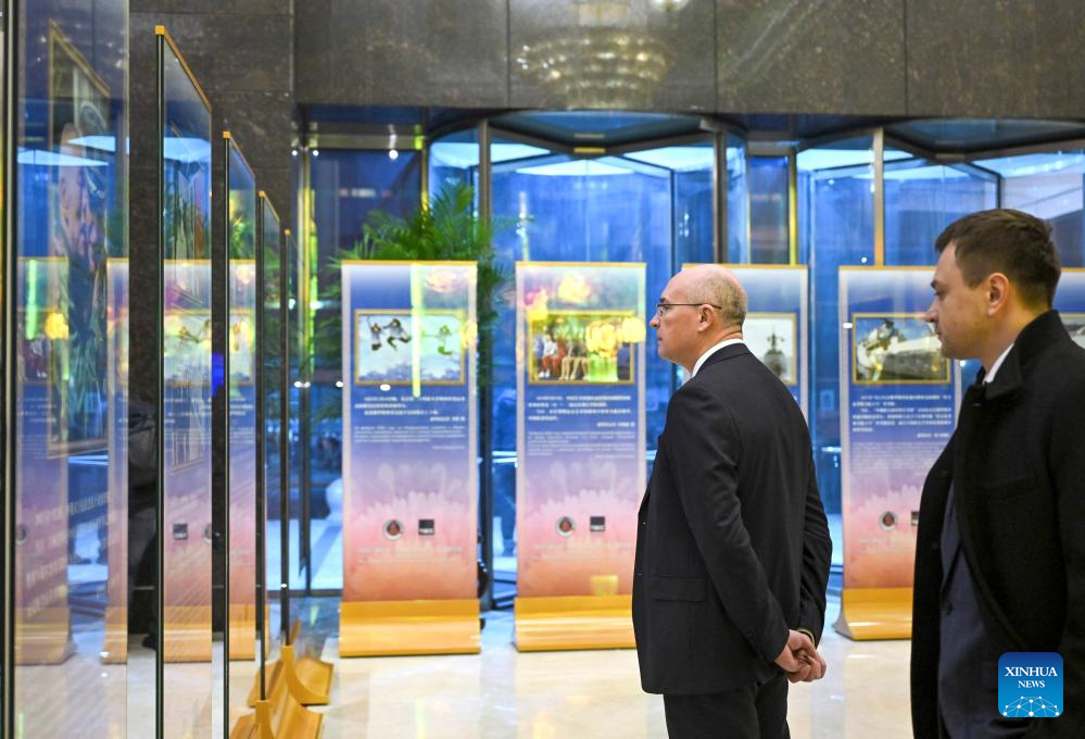 People visit a news photo exhibition on China-Russia friendship and cooperation in the new era in Beijing, capital of China, Dec. 15, 2025. A news photo exhibition jointly organized by China's Xinhua News Agency and Russia's TASS News Agency was held in Beijing on Monday. (Xinhua/Jin Liangkuai)