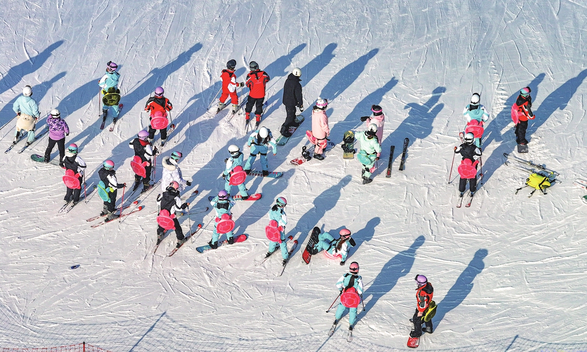 Tourists play at the Qipan Mountain Ice and Snow World in Shenyang, Northeast China's Liaoning Province, on December 14, 2025. During the 2024-2025 ski season, consumer spending on winter sports and related activities exceeded 187.5 billion yuan ($26,58 billion), up more than 25 percent year-on-year. Photo: VCG