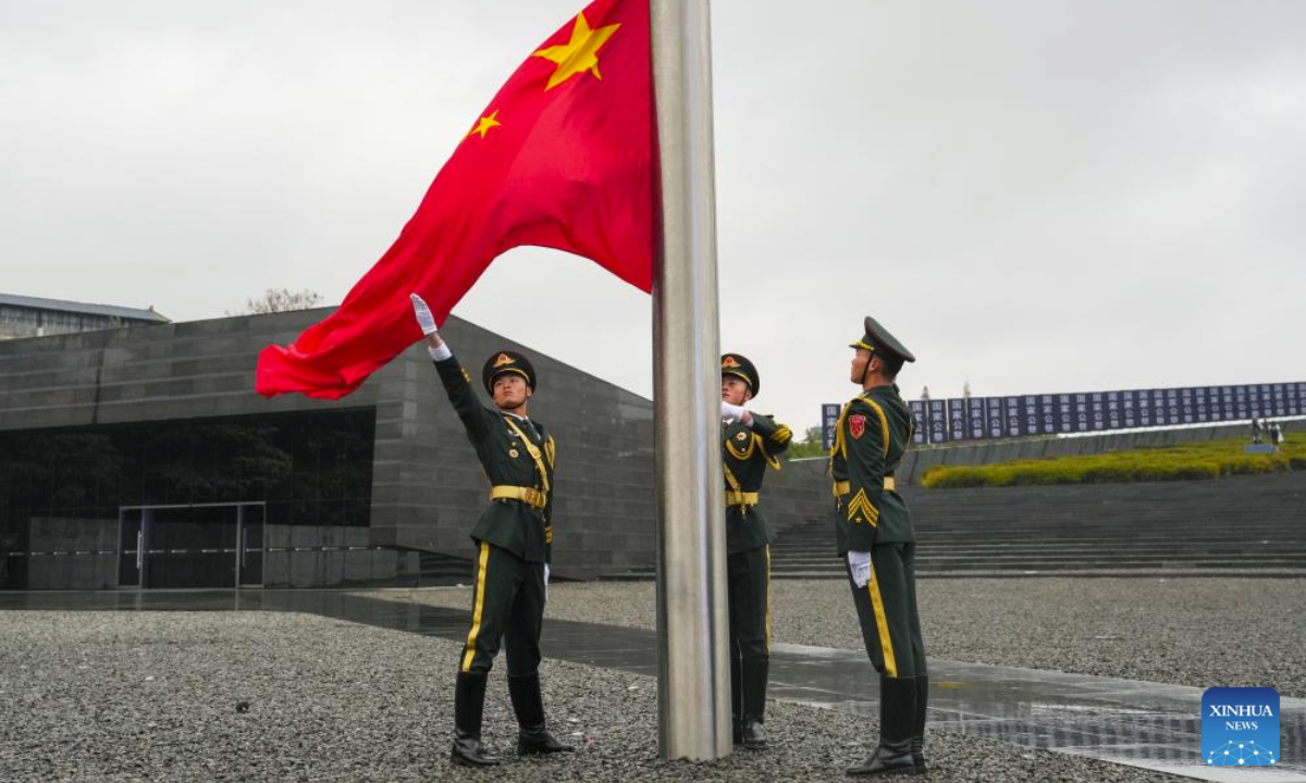 A flag-raising ceremony and a ceremony to lower the China's national flag at half mast are held at the Memorial Hall of the Victims in Nanjing Massacre by Japanese Invaders in Nanjing, capital of east China's Jiangsu Province, Dec. 13, 2025. Saturday marks the 12th national memorial ceremony for the Nanjing Massacre victims. (Xinhua/Li Bo)