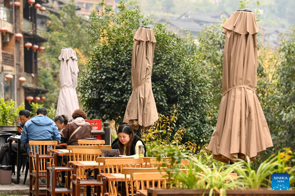 Tourists visit the Gongtan Ancient Town in Youyang Tujia and Miao Autonomous County, southwest China's Chongqing Municipality, on Dec. 11, 2025. (Photo by Qiu Hongbin/Xinhua)