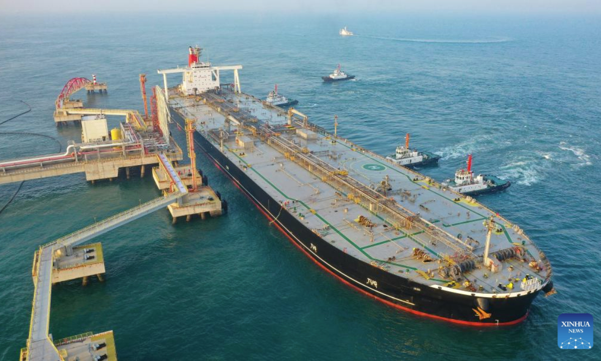 An aerial drone photo shows a foreign vessel carrying petrochemical raw materials berthing at Yangpu Port in Danzhou, south China's Hainan Province, Dec. 18, 2025. China on Thursday launched island-wide special customs operations in the Hainan Free Trade Port (FTP). (Xinhua/Guo Cheng)