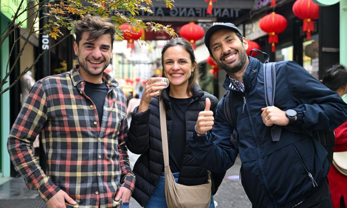 Tourists from Spain visit Tianzifang, an art area in east China's Shanghai, Dec. 3, 2024. Expanding visa-free policy is a milestone in China's journey toward greater openness and also shows its confidence on the global stage. (Photo by Chen Haoming/Xinhua)