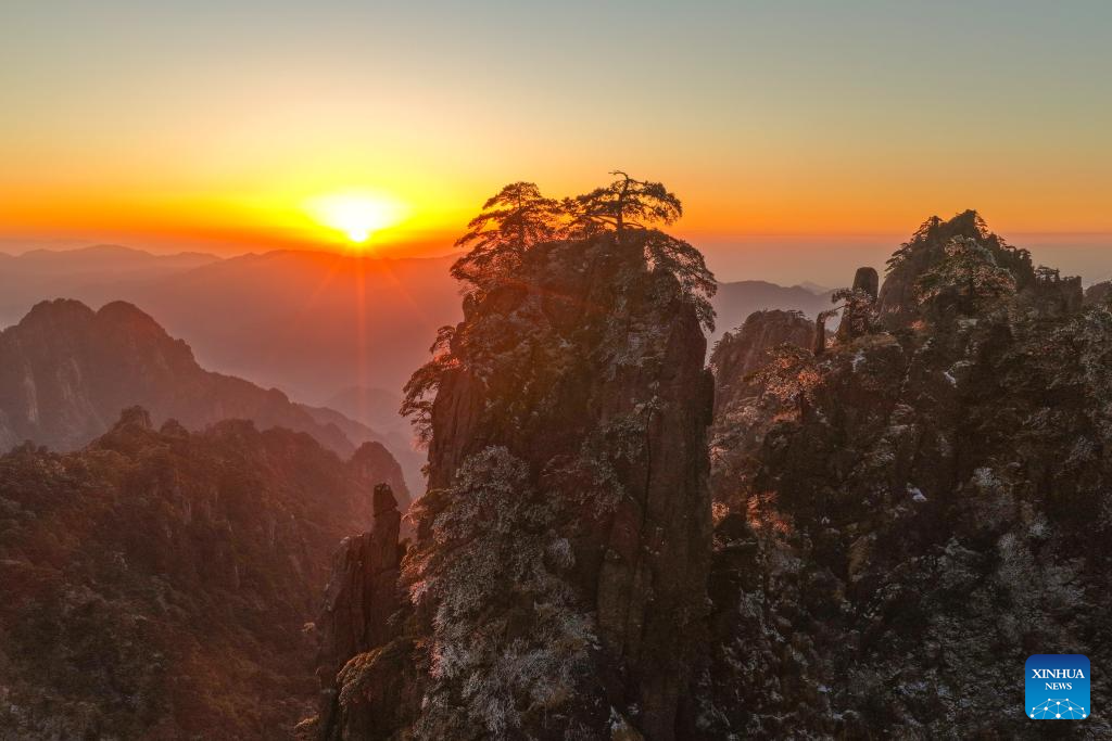 An aerial drone photo taken on Dec. 14, 2025 shows the Huangshan Mountain scenic area at sunrise after snow, in east China's Anhui Province. (Photo by Shi Yalei/Xinhua)