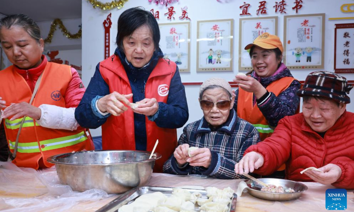 People make dumplings at a senior citizen activity center in Wuchang District of Wuhan City, central China's Hubei Province, Dec. 18, 2025. People all over the country held diverse events on Thursday to mark the Winter Solstice, which will fall on Dec. 21 this year. Winter Solstice, the shortest day of the year, denotes the beginning of deep winter and a break from farming in traditional agricultural society in Chinese culture. Northern China has maintained the tradition of eating dumplings on this day, while people in southern China eat tangyuan (glutinous rice balls). (Photo by Zhao Jun/Xinhua)
