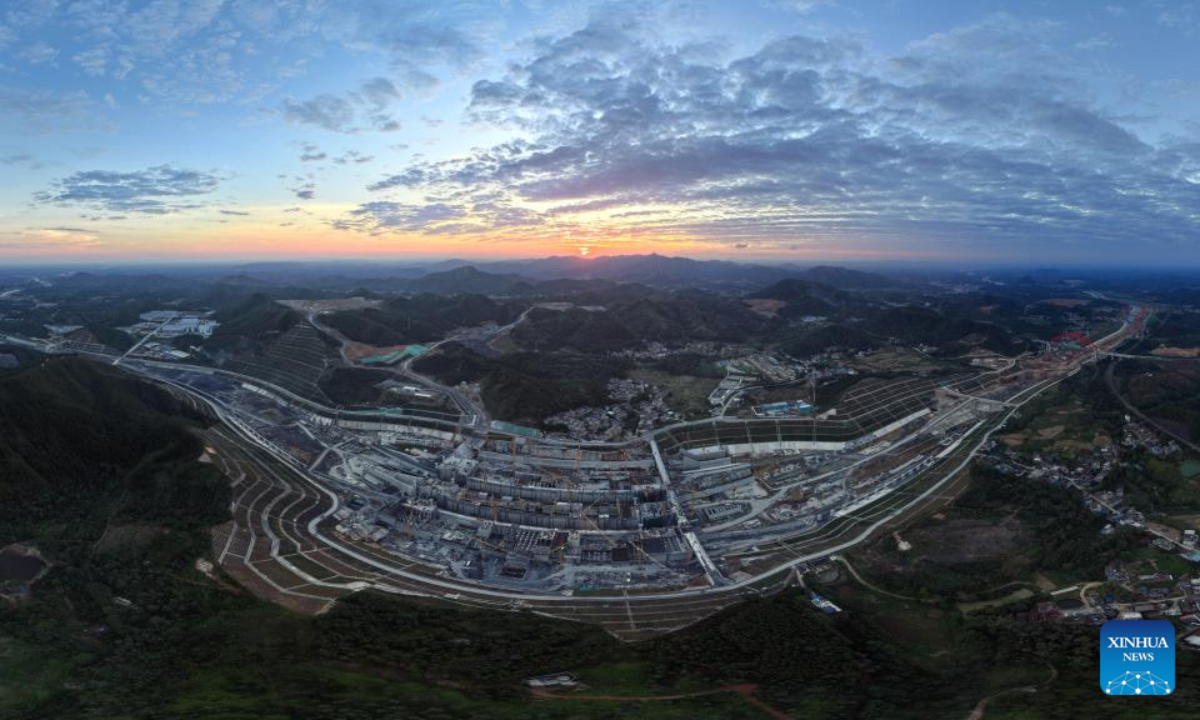 An aerial drone photo taken on Dec. 17, 2025 shows a reconstructed bridge over the Pinglu Canal in Qinzhou, south China's Guangxi Zhuang Autonomous Region. Three years on, the construction of the Pinglu Canal as a core component of the New International Land-Sea Trade Corridor has shown remarkable progress. Upon completion, the 134.2-km canal would wind its way across Nanning and Qinzhou of Guangxi until it reaches the Beibu Gulf. It is expected to serve as an artery for river-sea inter-modal transportation in the southwestern part of the country. (Xinhua/Zhang Ailin)