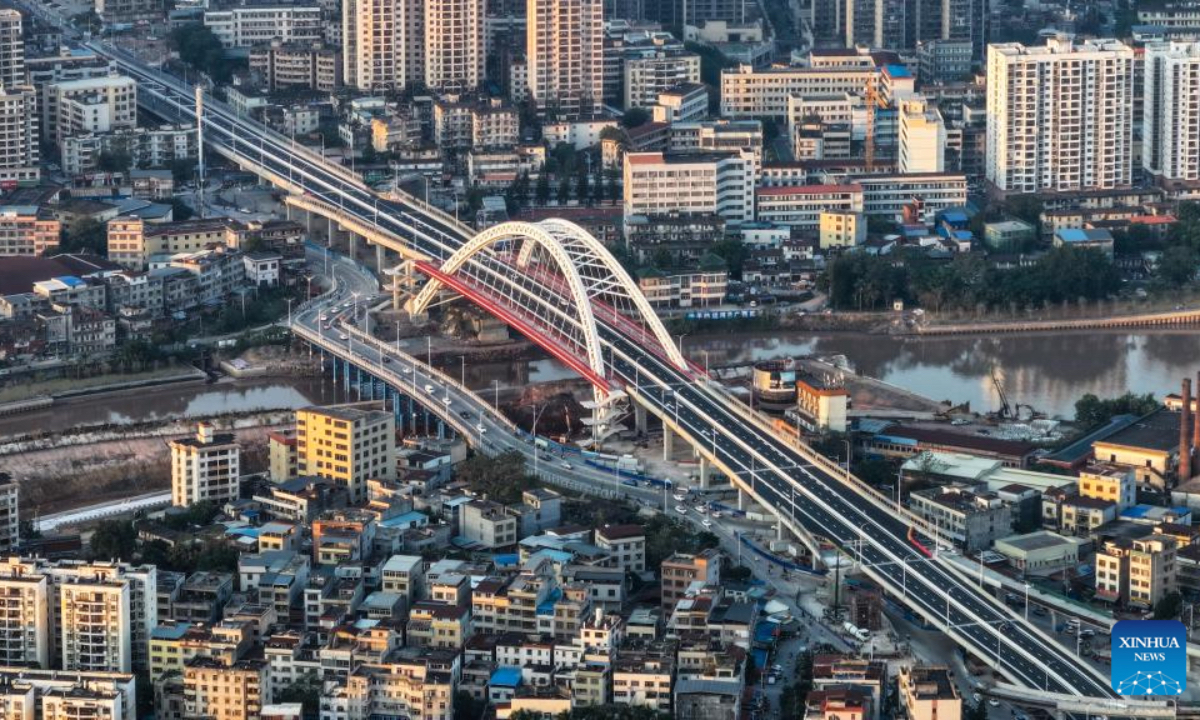 An aerial drone photo taken on Dec. 17, 2025 shows a reconstructed bridge over the Pinglu Canal in Qinzhou, south China's Guangxi Zhuang Autonomous Region. Three years on, the construction of the Pinglu Canal as a core component of the New International Land-Sea Trade Corridor has shown remarkable progress. Upon completion, the 134.2-km canal would wind its way across Nanning and Qinzhou of Guangxi until it reaches the Beibu Gulf. It is expected to serve as an artery for river-sea inter-modal transportation in the southwestern part of the country. (Xinhua/Zhang Ailin)