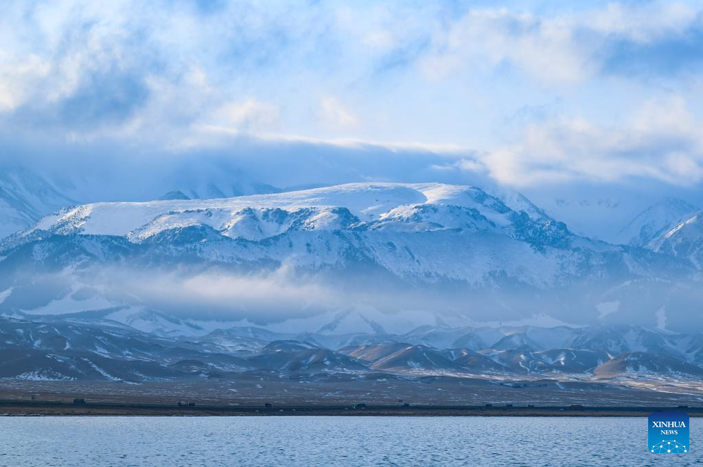 This photo taken on Dec. 16, 2025 shows the Sayram Lake with snow mountain in the background in Bortala Mongolian Autonomous Prefecture, northwest China's Xinjiang Uygur Autonomous Region. (Xinhua/Wang Fei)