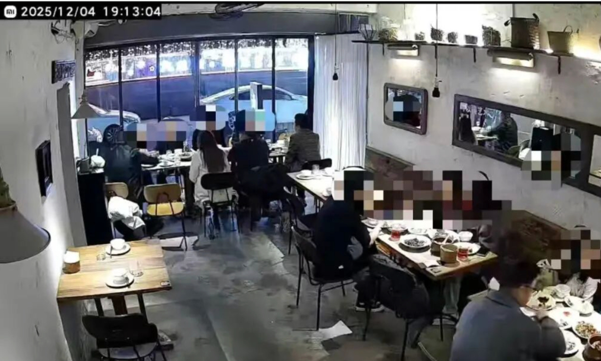 Screenshot of the surveillance footage showing 10 people having a meal together in the restaurant