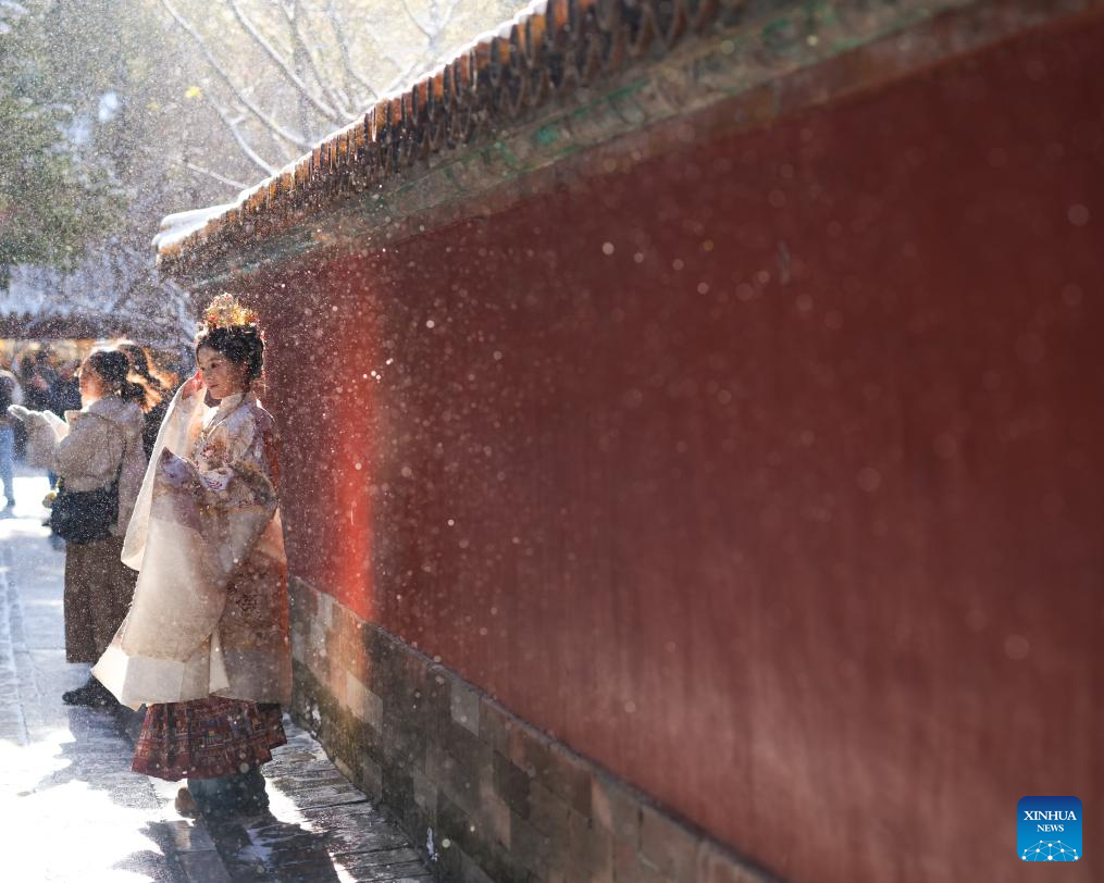 Tourists visit the Palace Museum after snowfall in Beijing, capital of China, Dec. 13, 2025. (Xinhua/Ma Xiaodong)