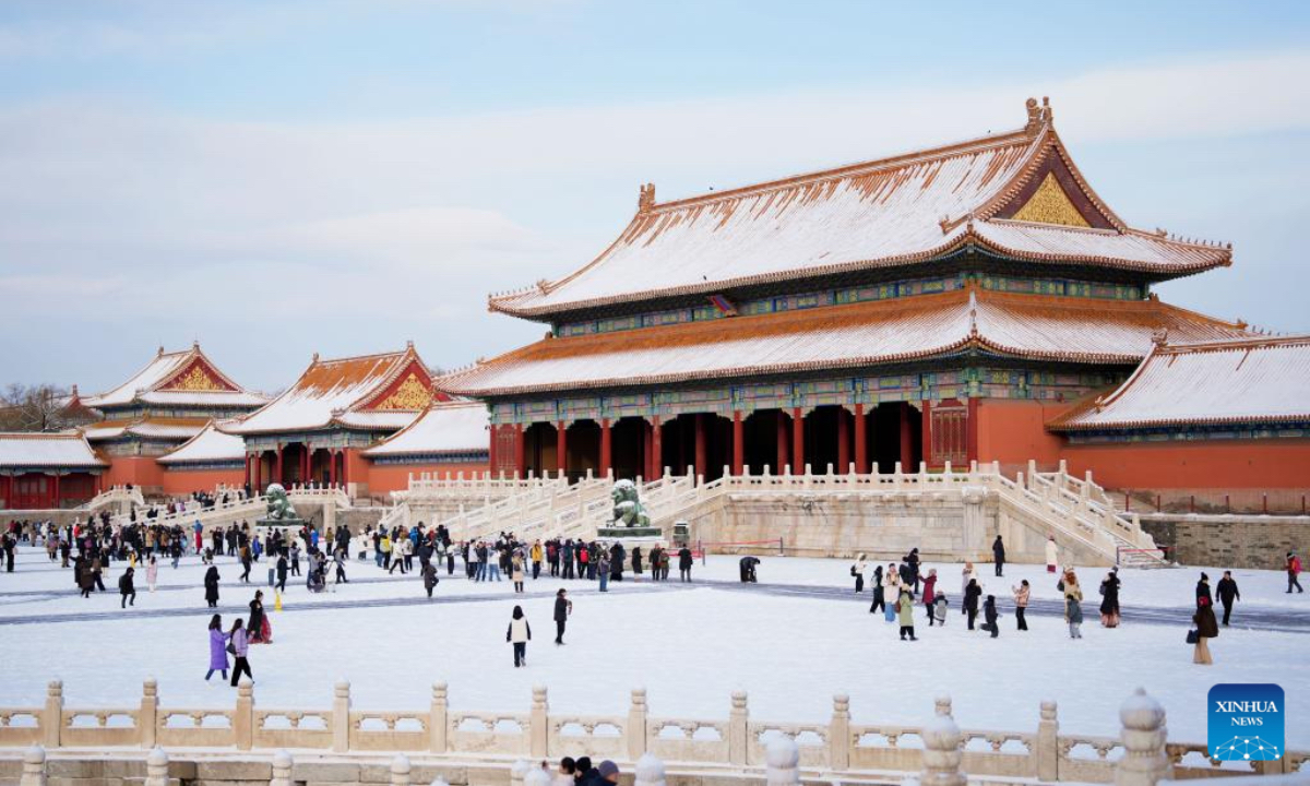 Tourists visit the Palace Museum after snowfall in Beijing, capital of China, Dec. 13, 2025. (Xinhua/Ma Xiaodong)