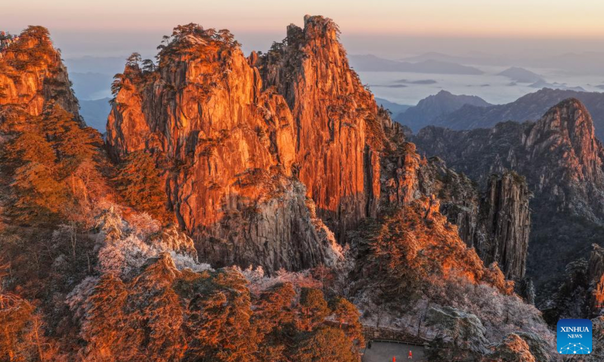 An aerial drone photo taken on Dec. 14, 2025 shows the Huangshan Mountain scenic area at sunrise after snow, in east China's Anhui Province. (Photo by Shi Yalei/Xinhua)