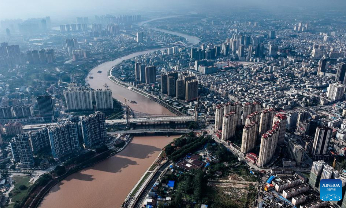 An aerial drone photo taken on Dec. 17, 2025 shows a reconstructed bridge over the Pinglu Canal in Qinzhou, south China's Guangxi Zhuang Autonomous Region. Three years on, the construction of the Pinglu Canal as a core component of the New International Land-Sea Trade Corridor has shown remarkable progress. Upon completion, the 134.2-km canal would wind its way across Nanning and Qinzhou of Guangxi until it reaches the Beibu Gulf. It is expected to serve as an artery for river-sea inter-modal transportation in the southwestern part of the country. (Xinhua/Zhang Ailin)