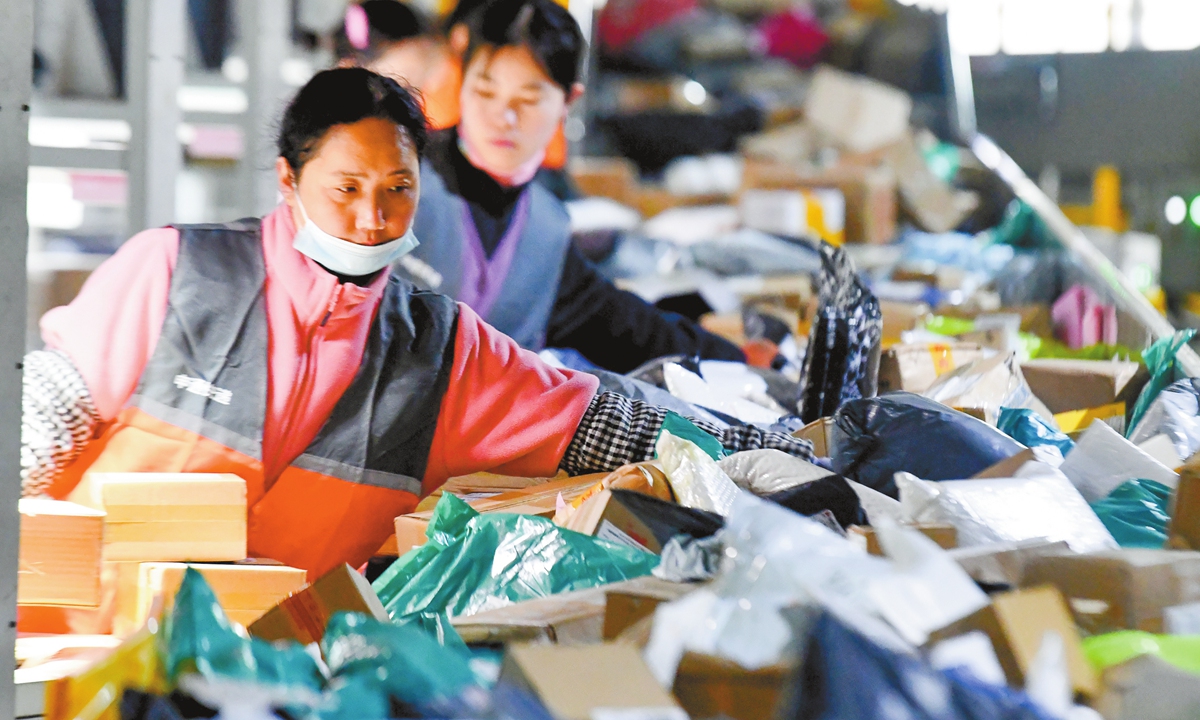 Staff sort packages at an express transit center in Shijiazhuang, North China's Hebei Province on December 11, 2025. China's express delivery service providers are faced with a surge of shipping orders due to the annual online shopping spree on December 12. Photo: VCG