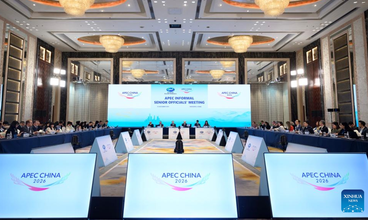 The logo of the APEC China Year is displayed on screens during the APEC Informal Senior Officials' Meeting (ISOM) in Shenzhen, south China's Guangdong Province, Dec. 12, 2025.