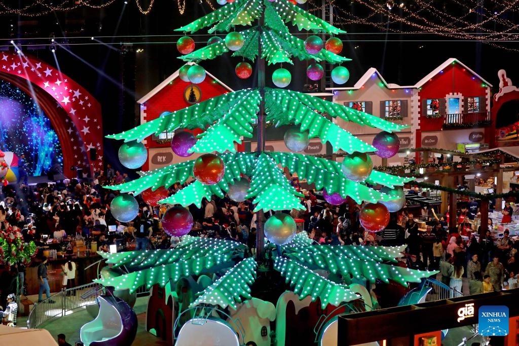 This photo taken on Dec. 12, 2025 shows people enjoying the Christmas atmosphere at a Christmas fair in Beirut, Lebanon. The Christmas fair, or the 13th session of the annual Christmas In Action, runs from Dec. 12 to Dec. 23. (Photo by Bilal Jawich/Xinhua)
