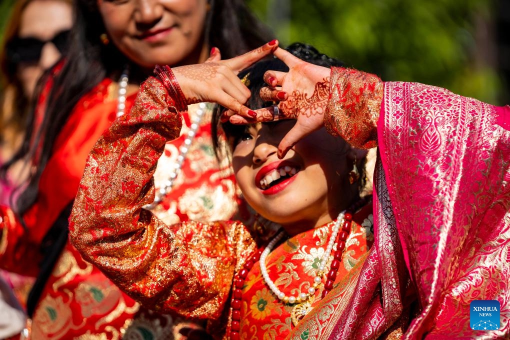 A girl worships the Sun during a puberty ceremony known as Gufa in Lalitpur, Nepal, on Dec. 13, 2025. (Photo by Hari Maharjan/Xinhua)