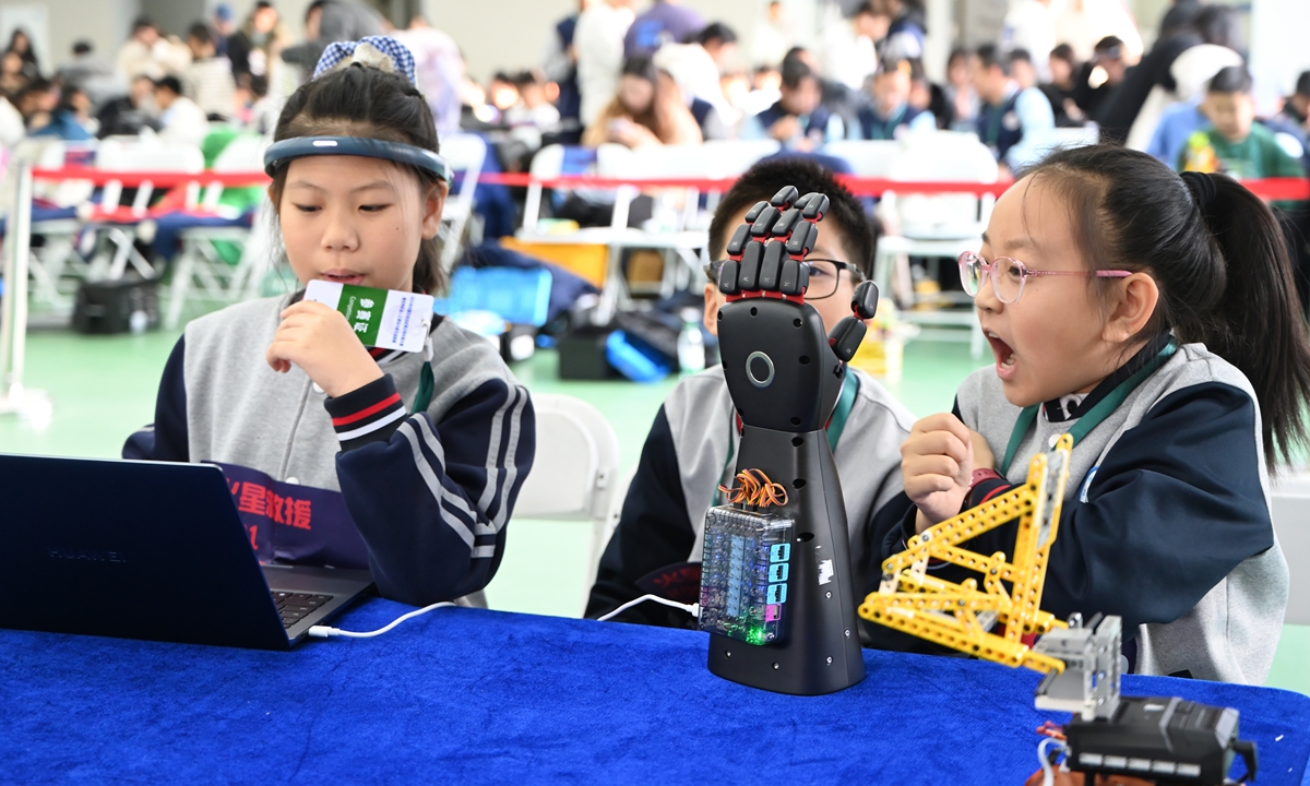 Students prepare to take part in an artificial intelligence-related competition on December 14, 2025, in Hohhot, North China's Inner Mongolia Autonomous Region. More than 2,000 young science and technology enthusiasts compete across 19 cutting-edge categories, including programming, robotics, brain science and artificial intelligence, applications of large-language AI models, and drones. Photo: VCG