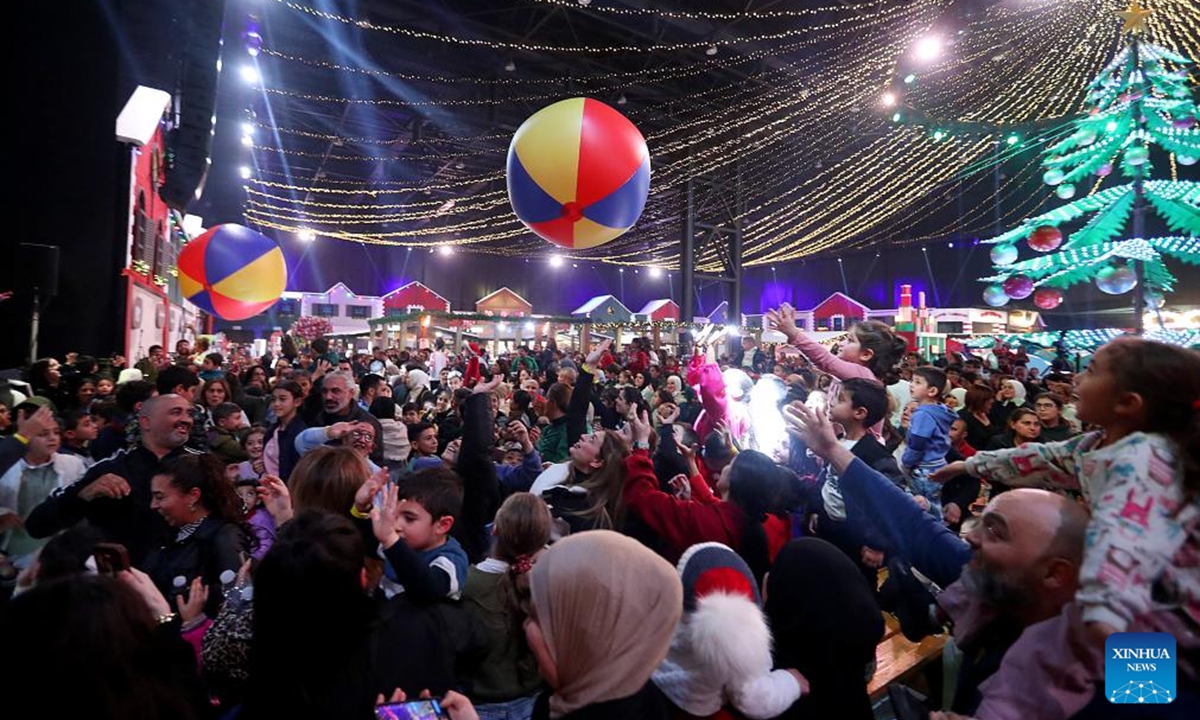 This photo taken on Dec. 12, 2025 shows people enjoying the Christmas atmosphere at a Christmas fair in Beirut, Lebanon. The Christmas fair, or the 13th session of the annual Christmas In Action, runs from Dec. 12 to Dec. 23. (Photo by Bilal Jawich/Xinhua)