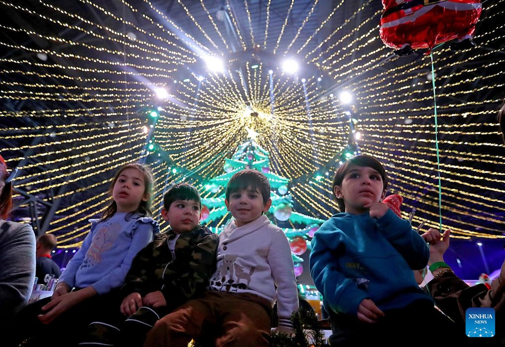 This photo taken on Dec. 12, 2025 shows people enjoying the Christmas atmosphere at a Christmas fair in Beirut, Lebanon. The Christmas fair, or the 13th session of the annual Christmas In Action, runs from Dec. 12 to Dec. 23. (Photo by Bilal Jawich/Xinhua)