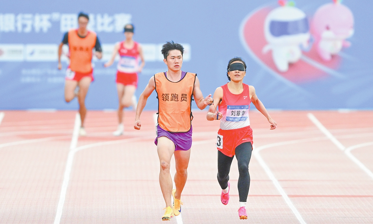 Liu Cuiqing (right) defends her title in the Women's 400m T11 final? in Guangzhou, South China's Guangdong Province, on December 13, 2025.