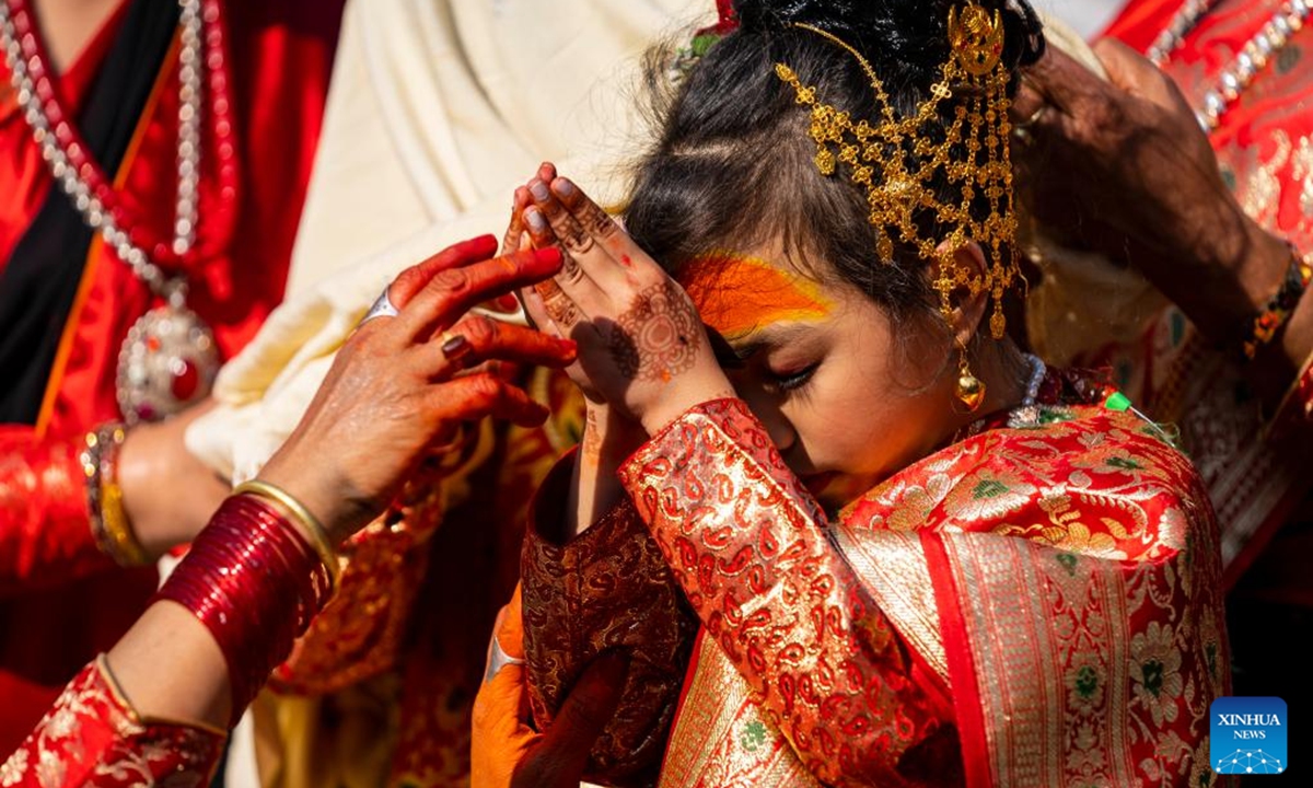 A girl participates in a puberty ceremony known as Gufa in Lalitpur, Nepal, on Dec. 13, 2025. (Photo by Hari Maharjan/Xinhua)