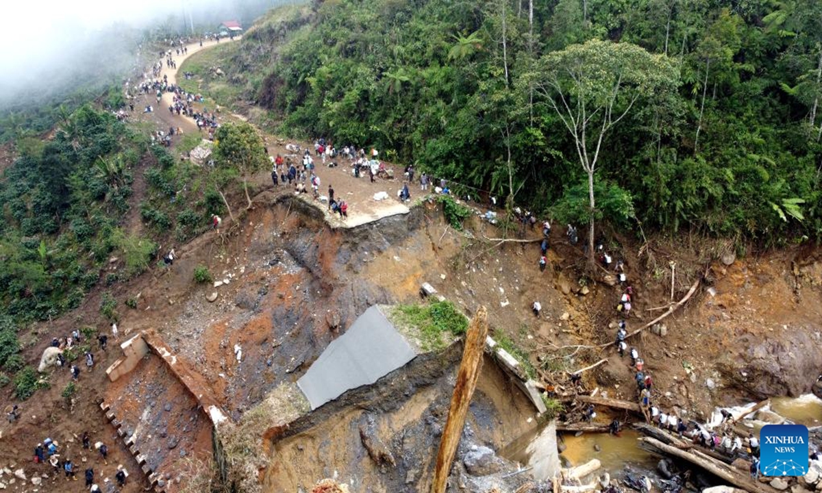An aerial drone photo shows a bridge damaged by floods in Bener Meriah regency, Aceh, Indonesia, Dec. 9, 2025. The death toll from floods and landslides that struck three provinces on Indonesia's Sumatra Island has exceeded 1,000, with 218 people still missing, according to the latest data released Saturday by the National Disaster Management Agency (BNPB). (Photo by Yulham/Xinhua)