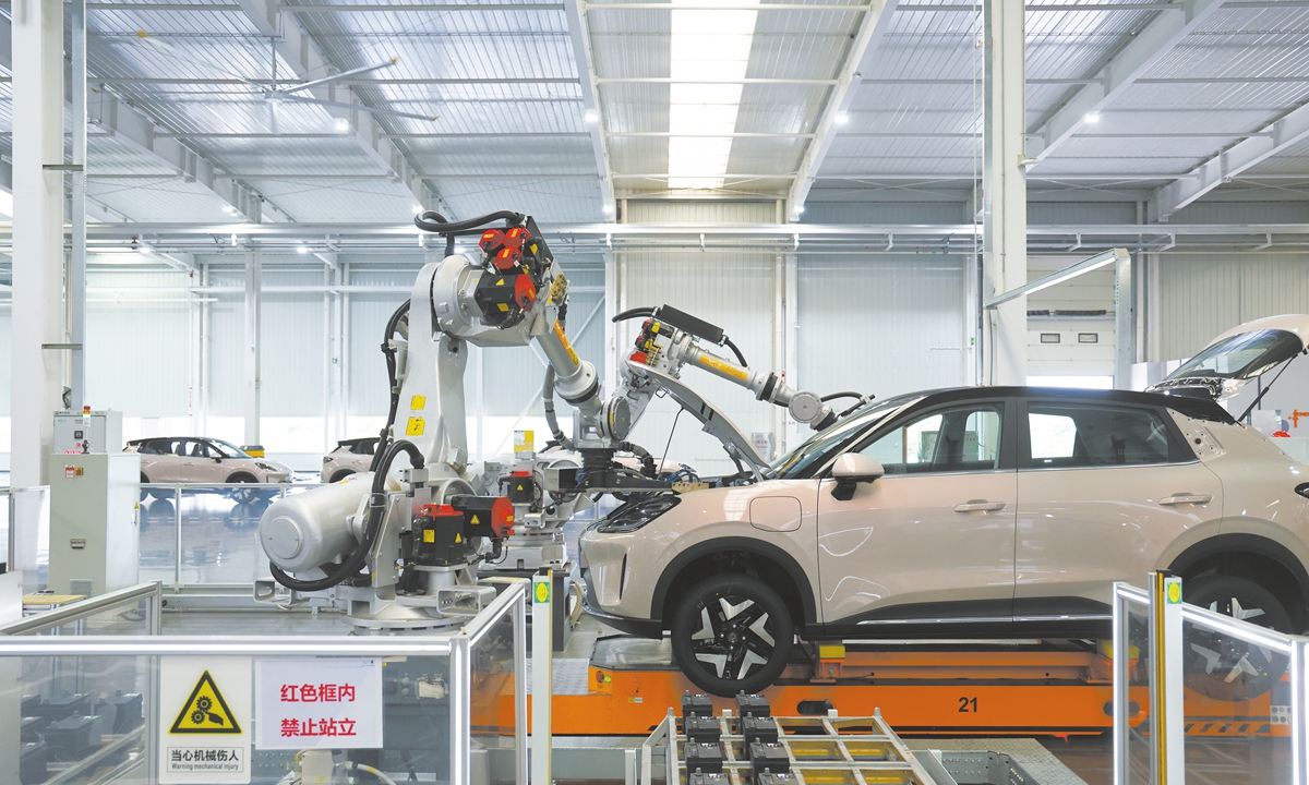 Robotic arms assemble vehicles on an automated production line at SAIC-GM-Wuling's Baojun manufacturing base in Liuzhou, South China's Guangxi Zhuang Autonomous Region, on November 17, 2025. Photo: VCG