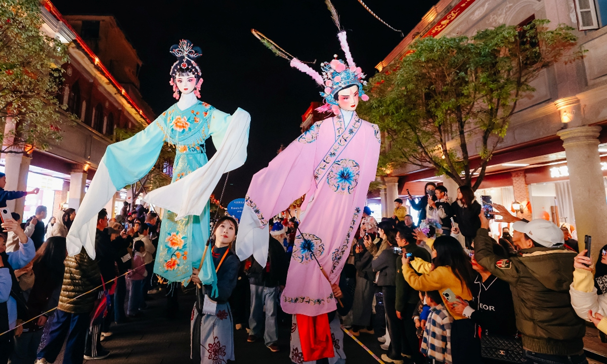 Puppet performance troupes participate in a parade and interact with local residents and tourists during the Quanzhou International Puppet Festival on December 14, 2025, in Quanzhou, East China's Fujian Province. Puppeteers from home and abroad presented various puppet shows at the festival, delivering a visual feast for the audience. Photo: VCG
