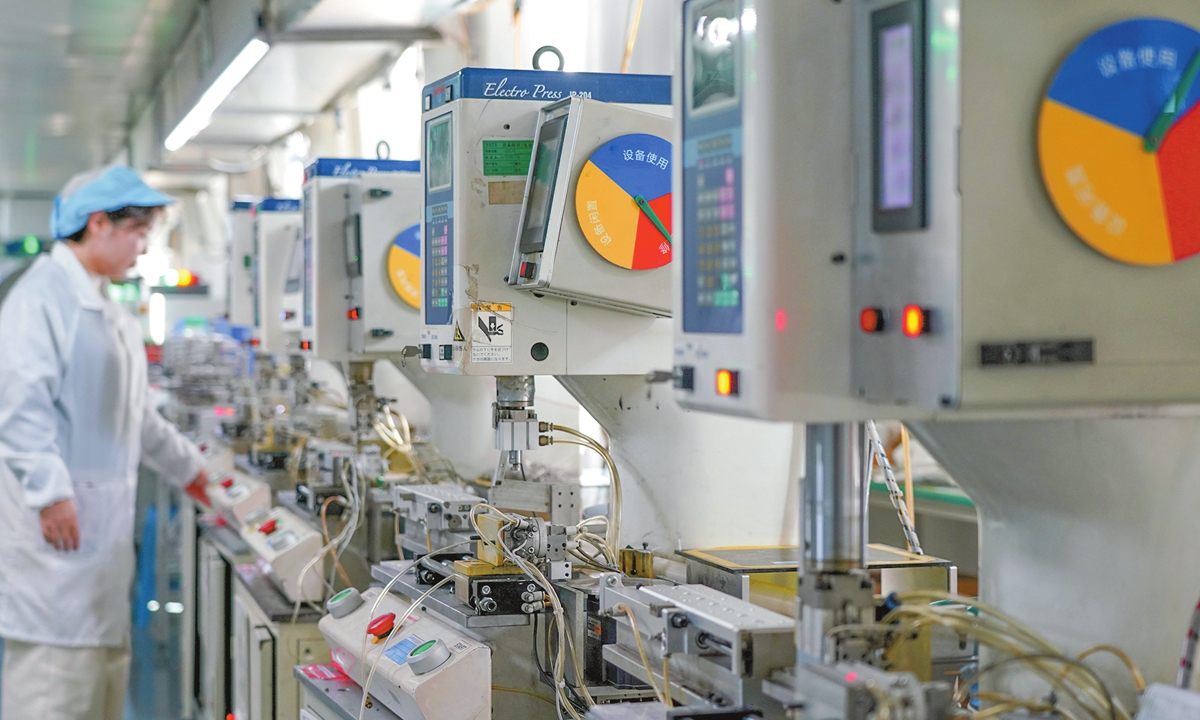 A worker operates in a micro electric motor workshop at a company in Yueqing, East China's Zhejiang Province on December 15, 2025. Enterprises across China are operating at full capacity to meet production demand at the end of the year. Photo: VCG