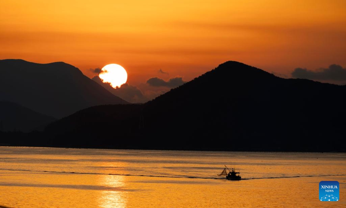 A fishing boat is seen during the sunrise in Tongyeong, South Korea, on Dec. 14, 2025. (Photo by Jun Hyosang/Xinhua)