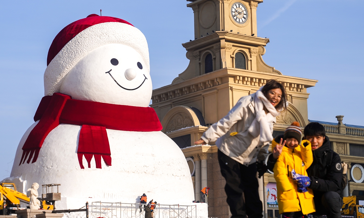 The iconic winter landmark, a giant snowman, stands tall by the Songhua River in Harbin, Northeast China's Heilongjiang Province, on December 15, 2025. This year's snowman, standing at a height of 19 meters and utilizing over 3,000 cubic meters of snow, is the largest ever created in its history. Photo: VCG