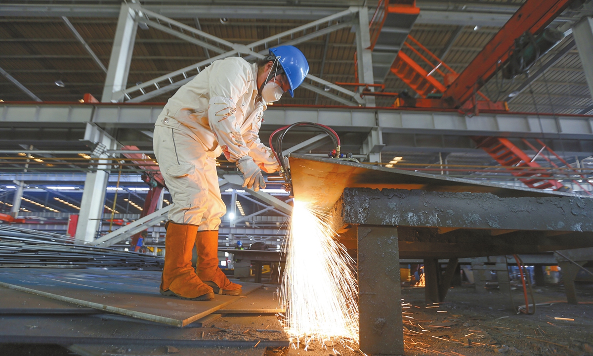 A worker is building hull components to meet growing orders at a shipyard in Yangzhou, East China's Jiangsu Province, on December 15, 2025. In the first three quarters, China's shipbuilding output reached 38.53 million deadweight tons, up 6 percent year-on-year. China's shipbuilding output accounted for 53.8 percent of the global total, new orders for 67.3 percent, and order backlog for 65.2 percent in deadweight tons - keeping its top spot worldwide, per industry data. Photo: VCG