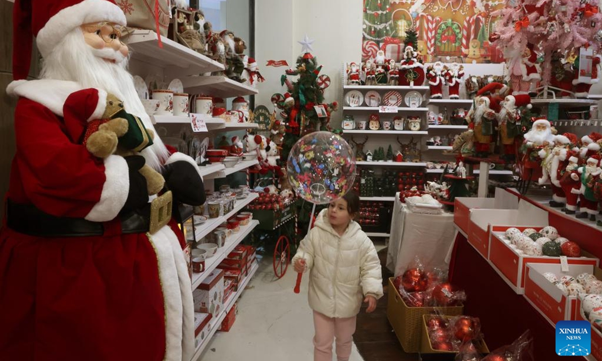 A girl views Christmas decorations at a store in the northern Israeli city of Nazareth on Dec. 18, 2025.

The Christmas celebrations came amid a fragile ceasefire between Israel and Hamas following two years of conflict in the Gaza Strip. Scenes of holiday activities highlighted moments of relative calm and a desire for normalcy among local communities during the Christmas season. (Photo by Gil Cohen Magen/Xinhua)