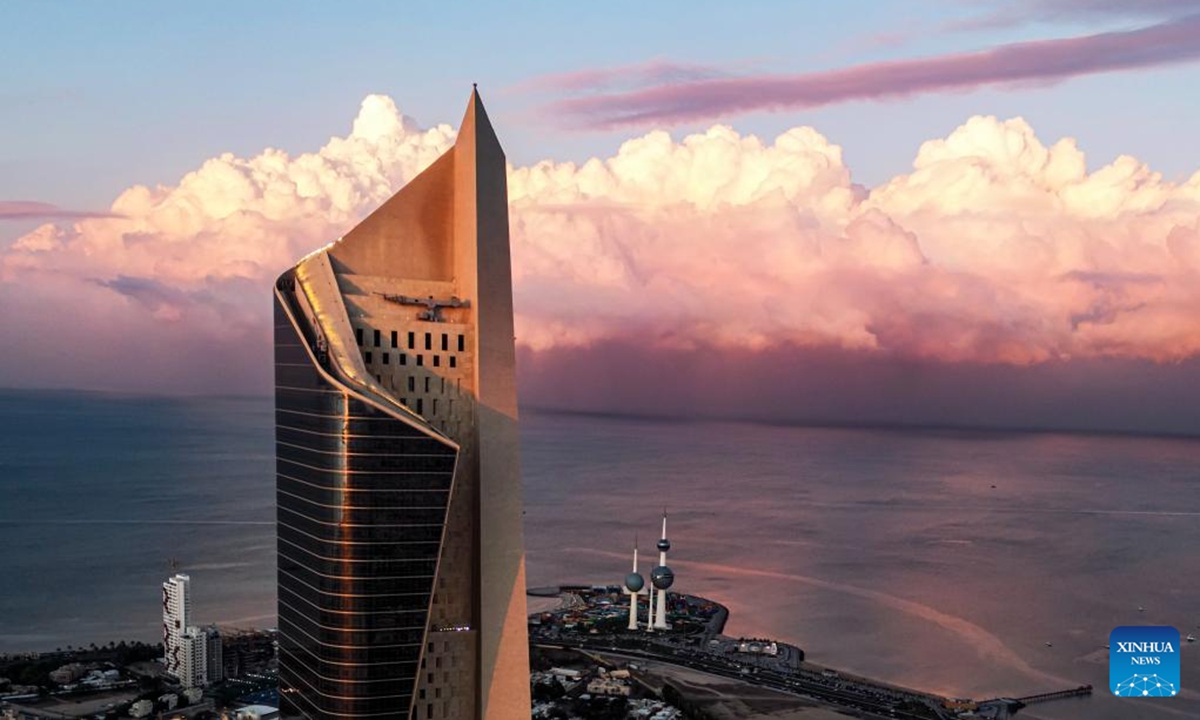 A drone photo taken on Dec. 17, 2025 shows a city view with clouds rolling over Kuwait City, Kuwait. (Photo by Asad/Xinhua)