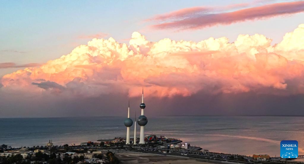 A drone photo taken on Dec. 17, 2025 shows a city view with clouds rolling over Kuwait City, Kuwait. (Photo by Asad/Xinhua)