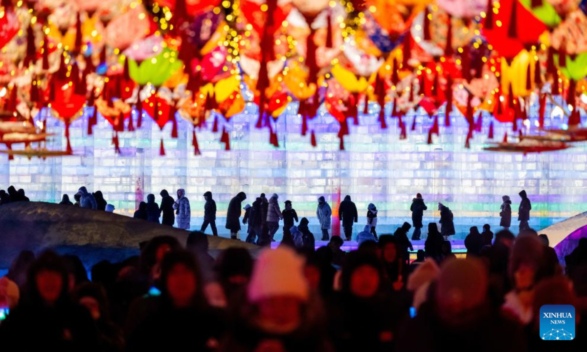 People visit an ice and snow theme park in Manzhouli, north China's Inner Mongolia Autonomous Region, Dec. 20, 2025. The 22nd China-Russia-Mongolia international ice and snow festival opened here on Saturday. The theme park created for the festival covers an area of 128,000 square meters. (Xinhua/Lian Zhen)