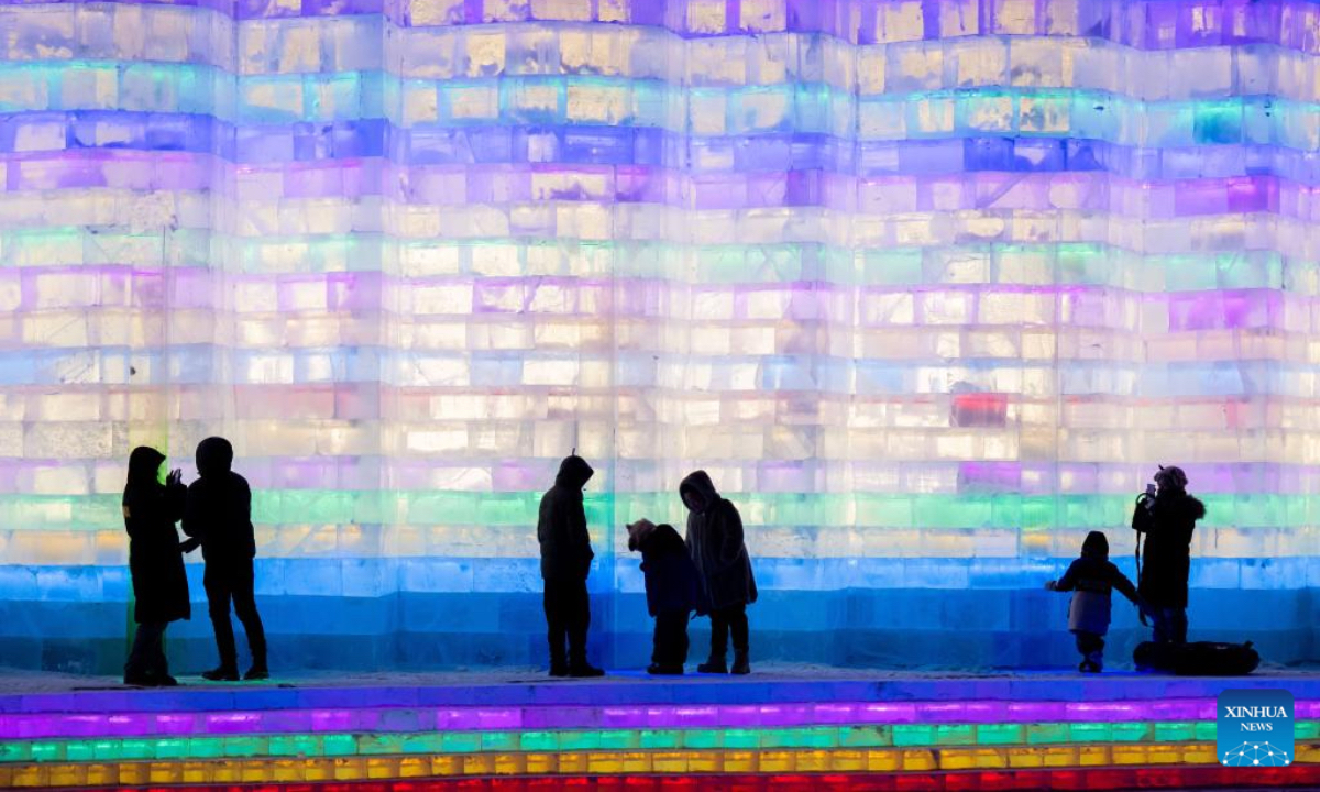 People visit an ice and snow theme park in Manzhouli, north China's Inner Mongolia Autonomous Region, Dec. 20, 2025. The 22nd China-Russia-Mongolia international ice and snow festival opened here on Saturday. The theme park created for the festival covers an area of 128,000 square meters. (Xinhua/Lian Zhen)
