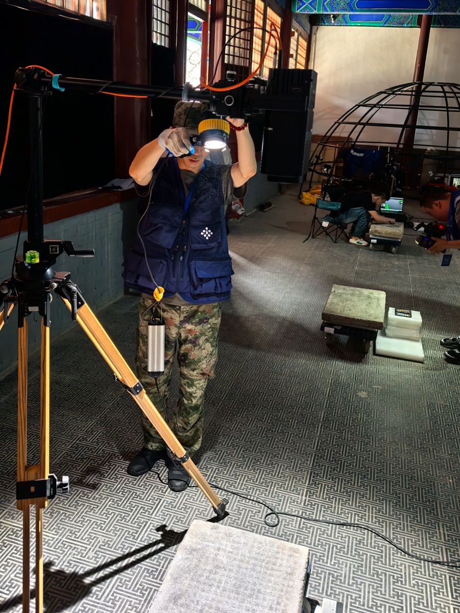 Staff members of the Hui Pengyu team calibrate the micro-trace enhancement equipment. Photo: Courtesy of Hui Pengyu