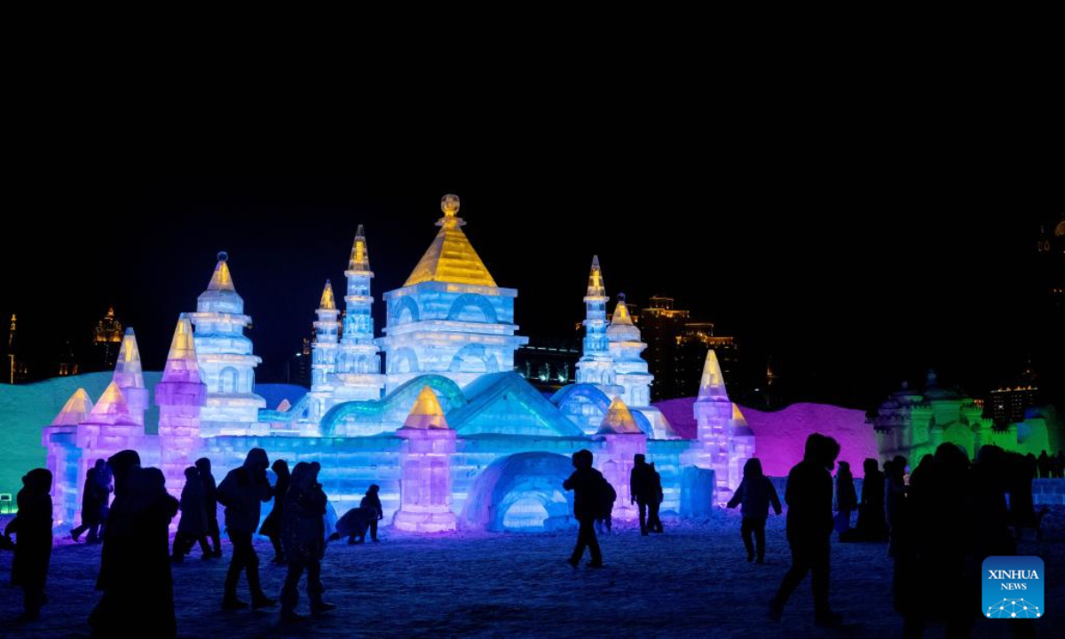 People visit an ice and snow theme park in Manzhouli, north China's Inner Mongolia Autonomous Region, Dec. 20, 2025. The 22nd China-Russia-Mongolia international ice and snow festival opened here on Saturday. The theme park created for the festival covers an area of 128,000 square meters. (Xinhua/Lian Zhen)