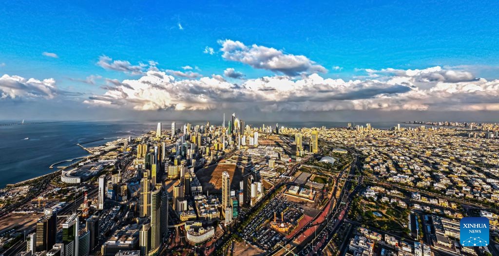 An aerial drone photo taken on Dec. 17, 2025 shows a city view with clouds rolling over Kuwait City, Kuwait. (Photo by Asad/Xinhua)
