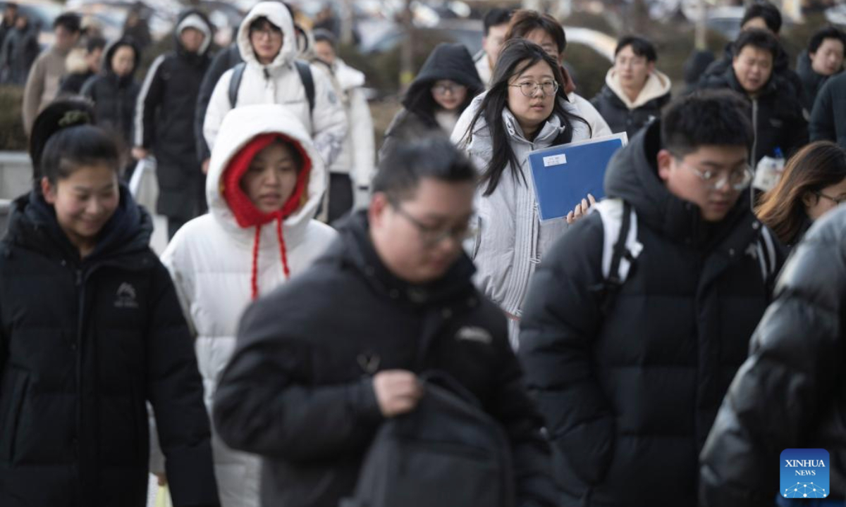 Examinees prepare to enter an examination site for the 2026 postgraduate entrance exam in Harbin, northeast China's Heilongjiang Province, Dec. 20, 2025. China's national exam for postgraduate enrolment kicked off on Saturday. (Xinhua/Zhang Tao)